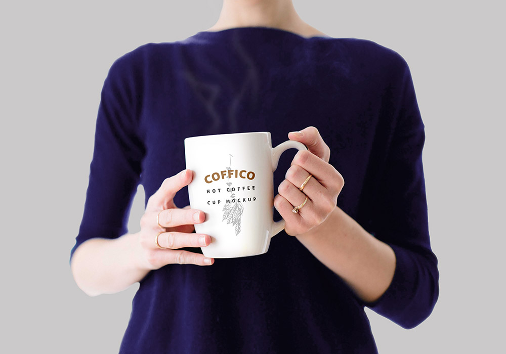 Woman Holding a Coffee Mug Mockup PSD